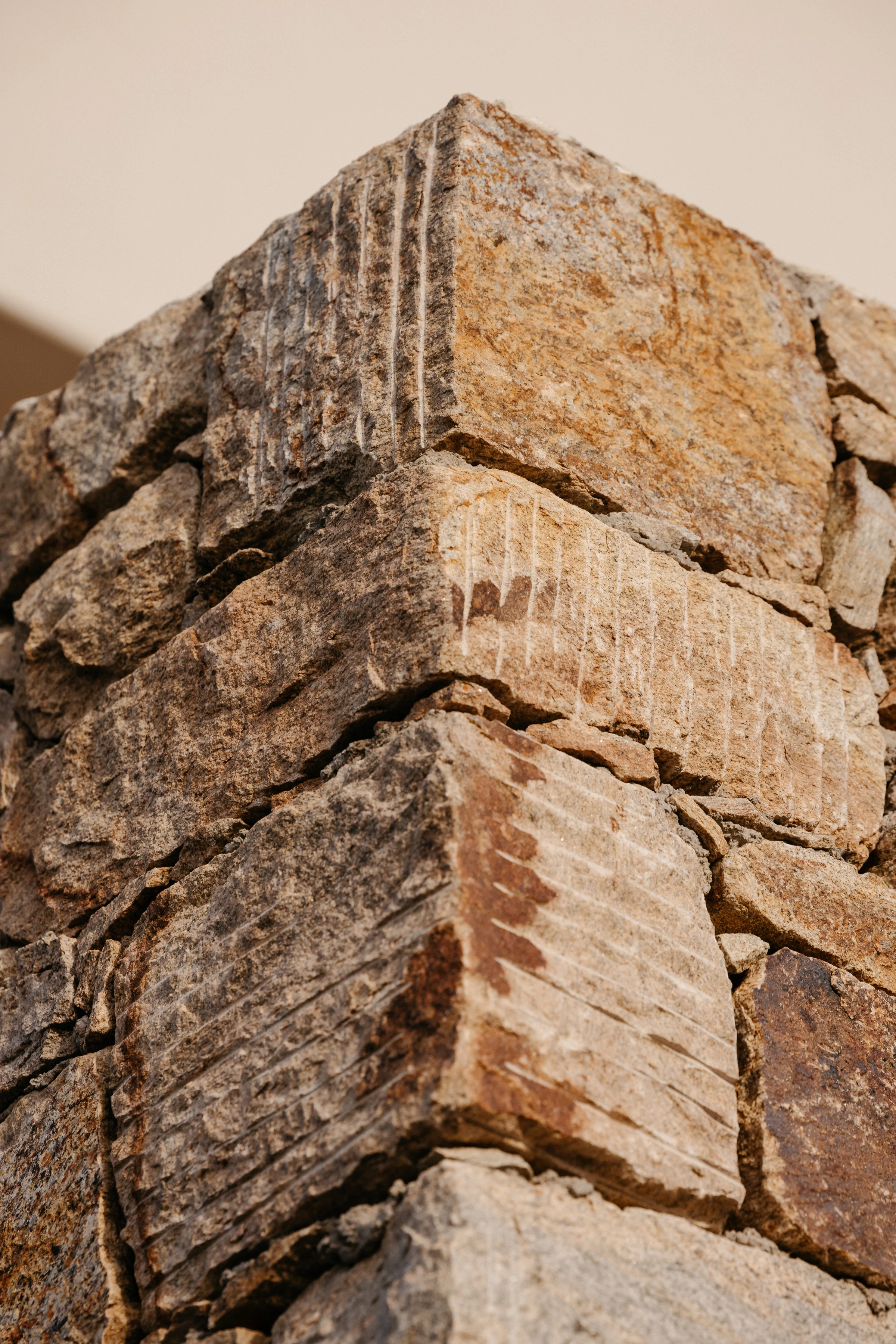 A chiselled dry-stone corner in warm light