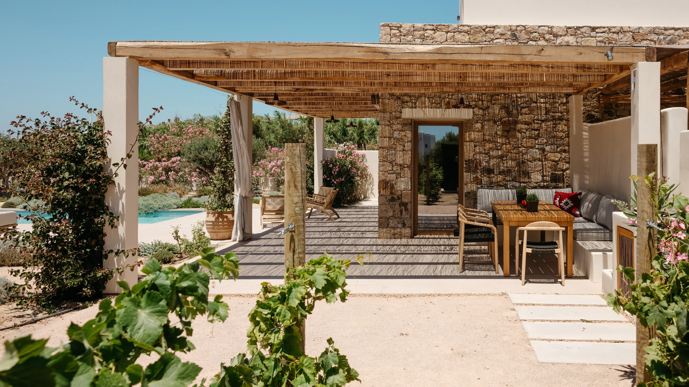 A wide view of the terrace with the pool beyond