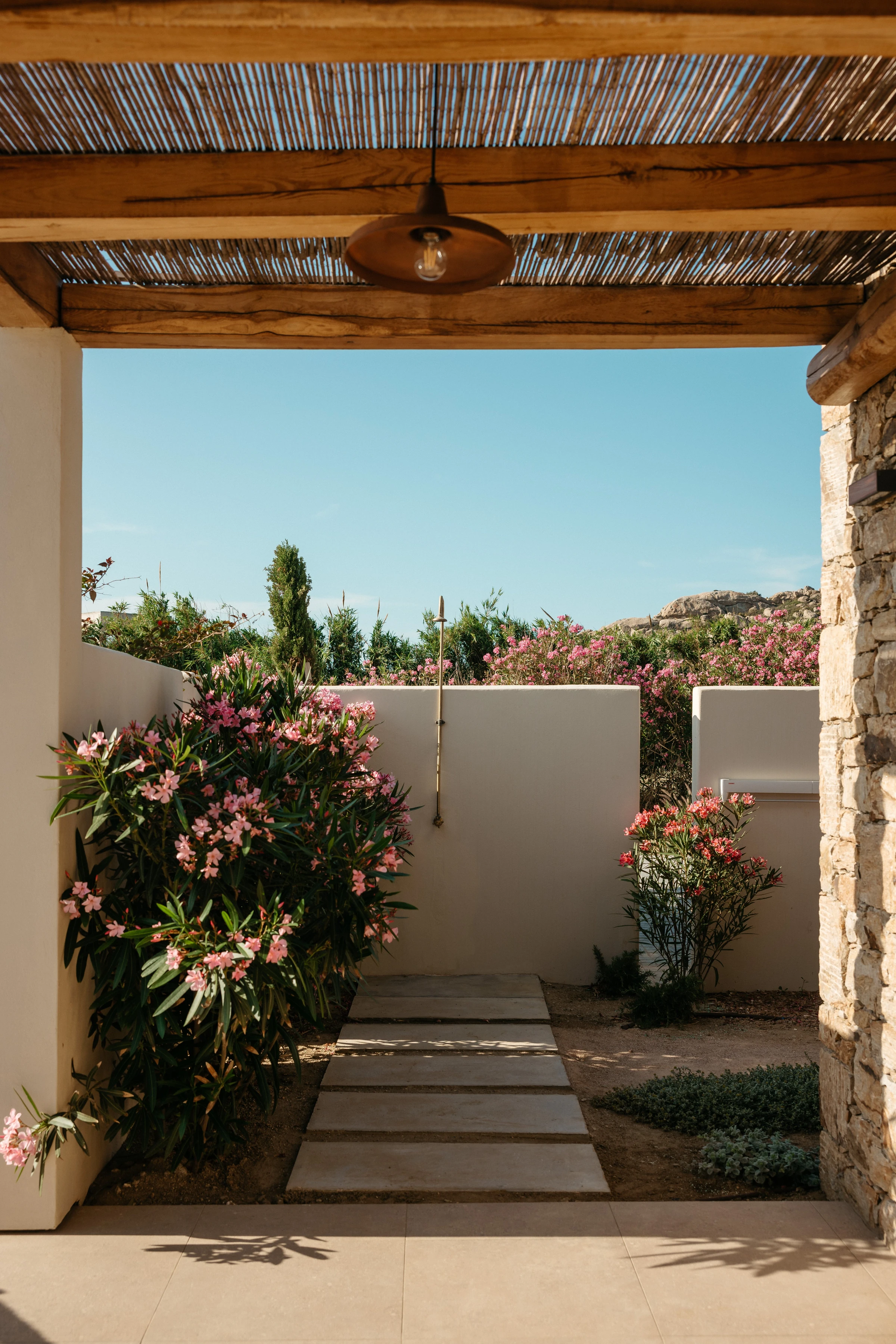The outdoor shower and stepping-stone path